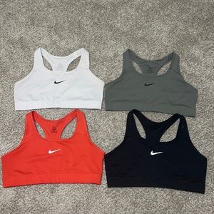 NIKE! 4 nike swoosh sports bras! Colors: White, Grey, Red, Black Size: all XL